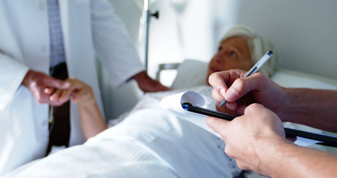 Doctor Checking on Senior Patient in Hospital Bed - Free Images, Stock Photos and Pictures on Pikwizard.com