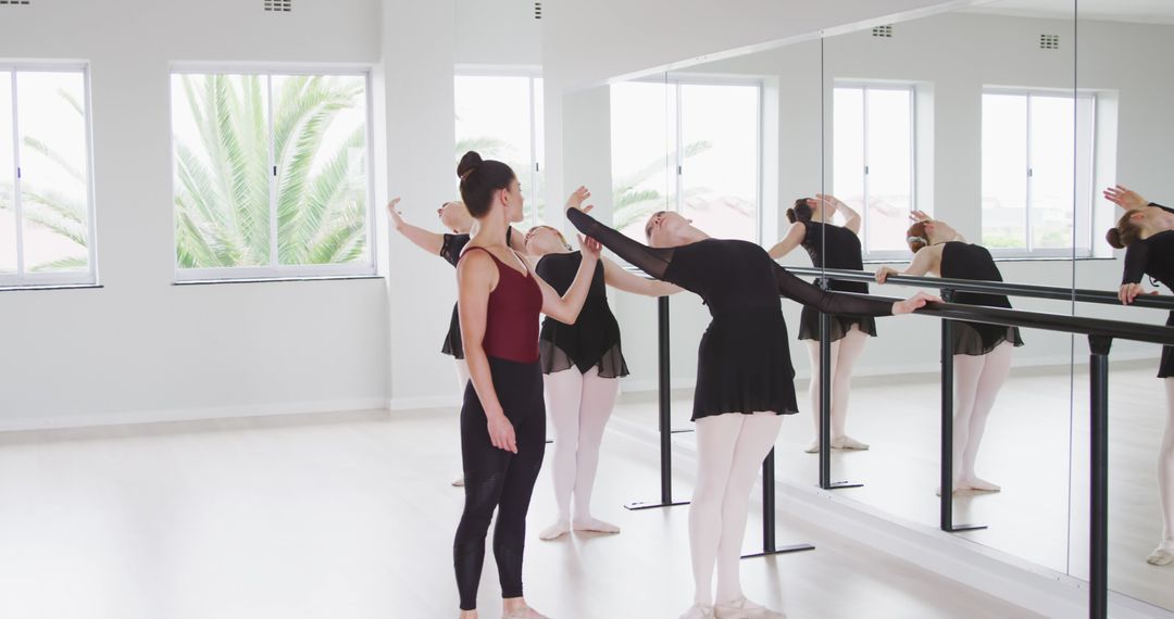 Ballet Instructor Training Female Dancers in Dance Studio - Free Images, Stock Photos and Pictures on Pikwizard.com