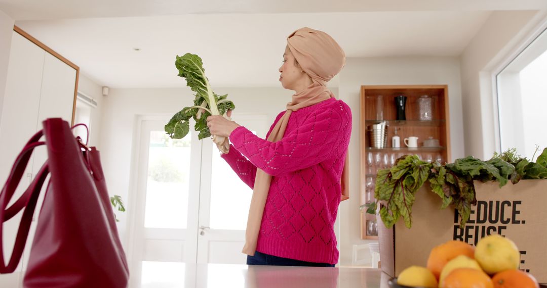 Woman Unpacking Fresh Vegetables in Bright Kitchen - Free Images, Stock Photos and Pictures on Pikwizard.com