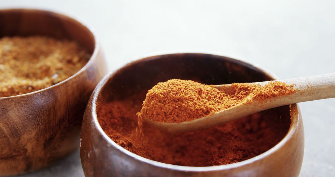 Close-Up of Ground Spices in Wooden Bowls with Wooden Spoon - Free Images, Stock Photos and Pictures on Pikwizard.com