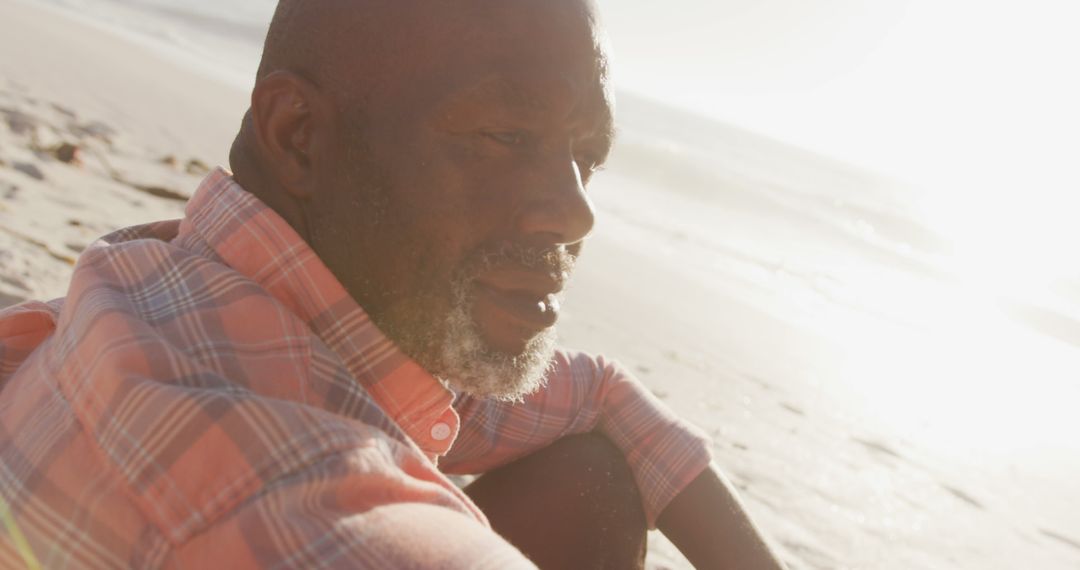 African American Man Contemplating Life on Beach at Sunset - Free Images, Stock Photos and Pictures on Pikwizard.com