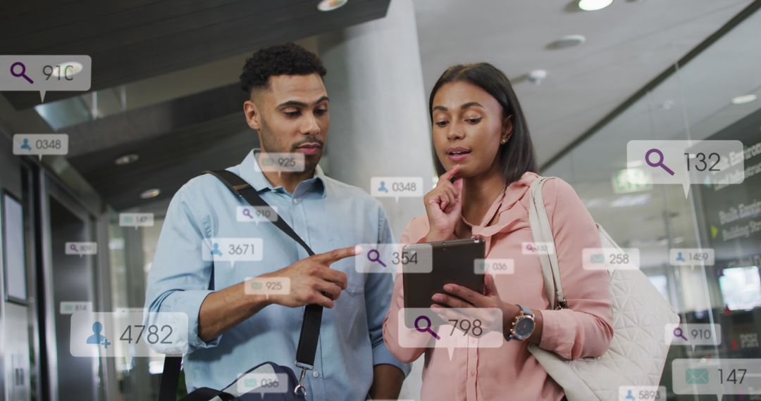 Coworkers Discussing Digital Reports Surrounded by Social Notifications