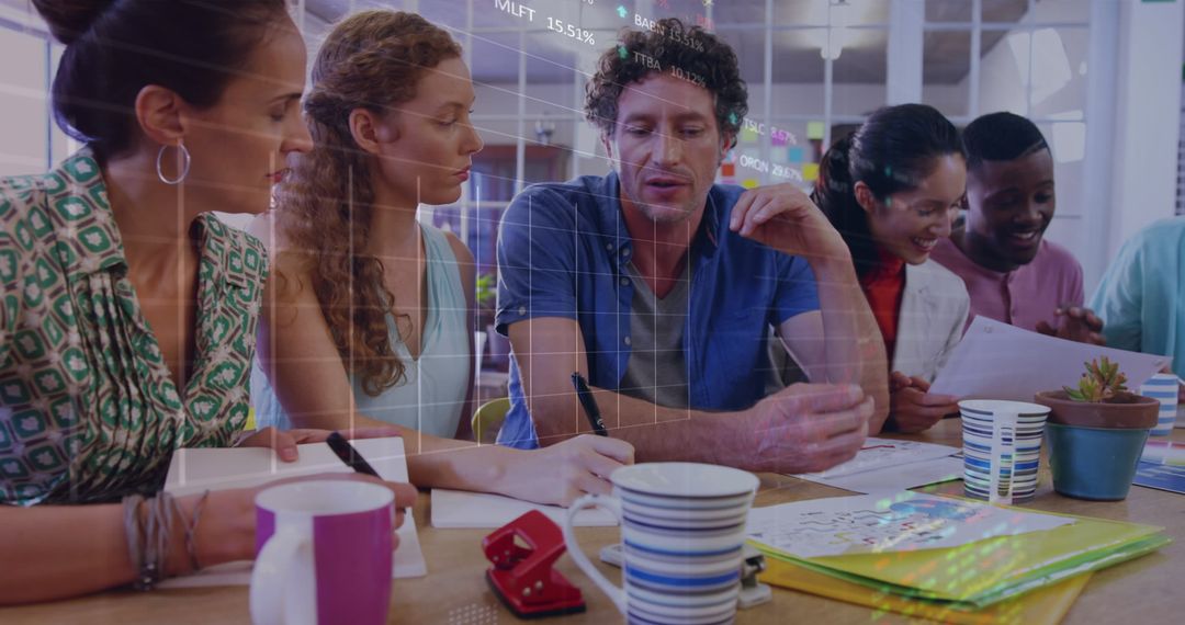 Diverse Colleagues Collaborating with Stock Market Data Overlay