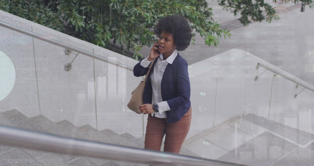 Businesswoman Discussing on Phone While Walking Upstairs