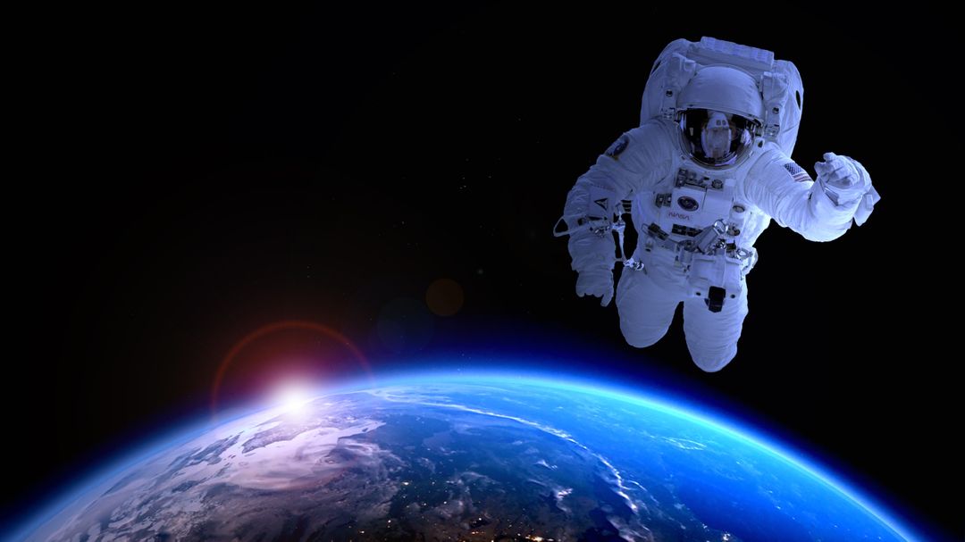 Astronaut Floating in Space Above Earth with Sunrise - Free Images, Stock Photos and Pictures on Pikwizard.com