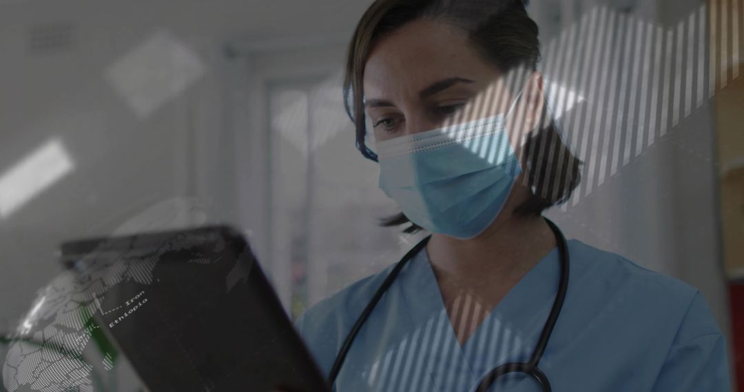 Nurse in Scrubs Reviewing Digital Tablet in Hospital Environment