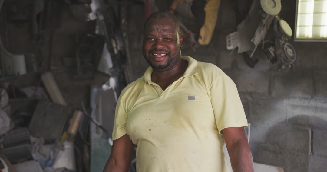 Smiling Handyman in Workshop Bringing Optimism to Repair Work