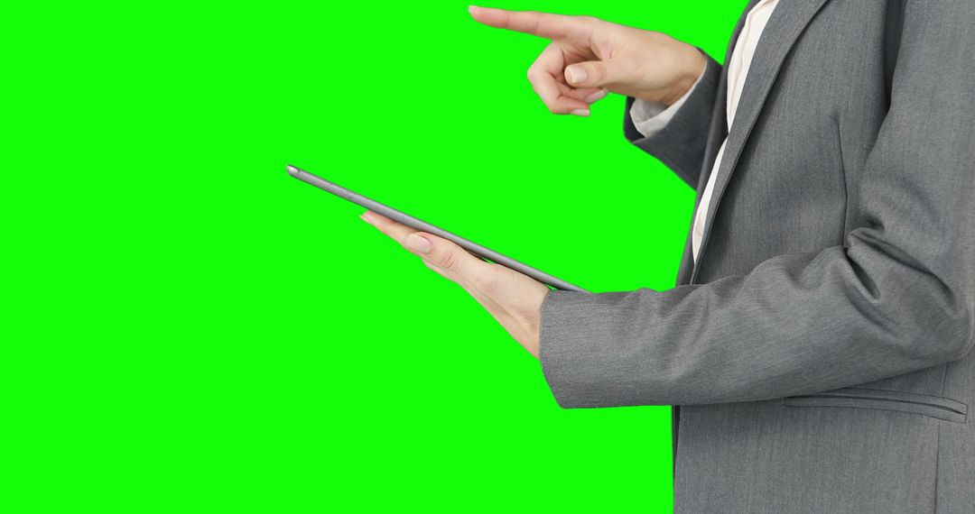 Close-Up of Business Person Holding Tablet and Pointing, Green Screen Background - Free Images, Stock Photos and Pictures on Pikwizard.com