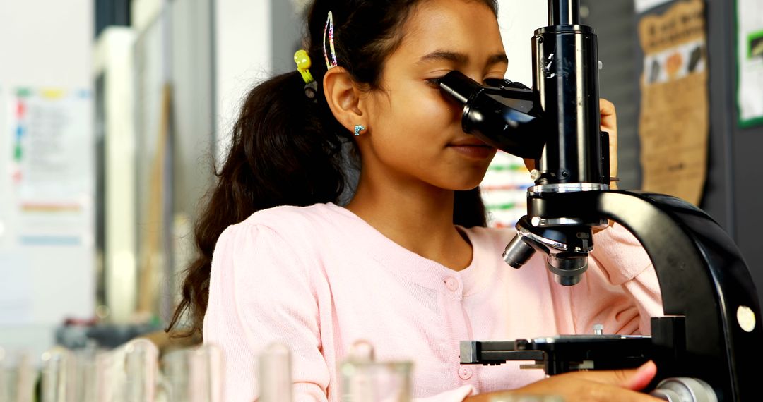 Curious Young Girl Using Microscope in Science Classroom - Free Images, Stock Photos and Pictures on Pikwizard.com