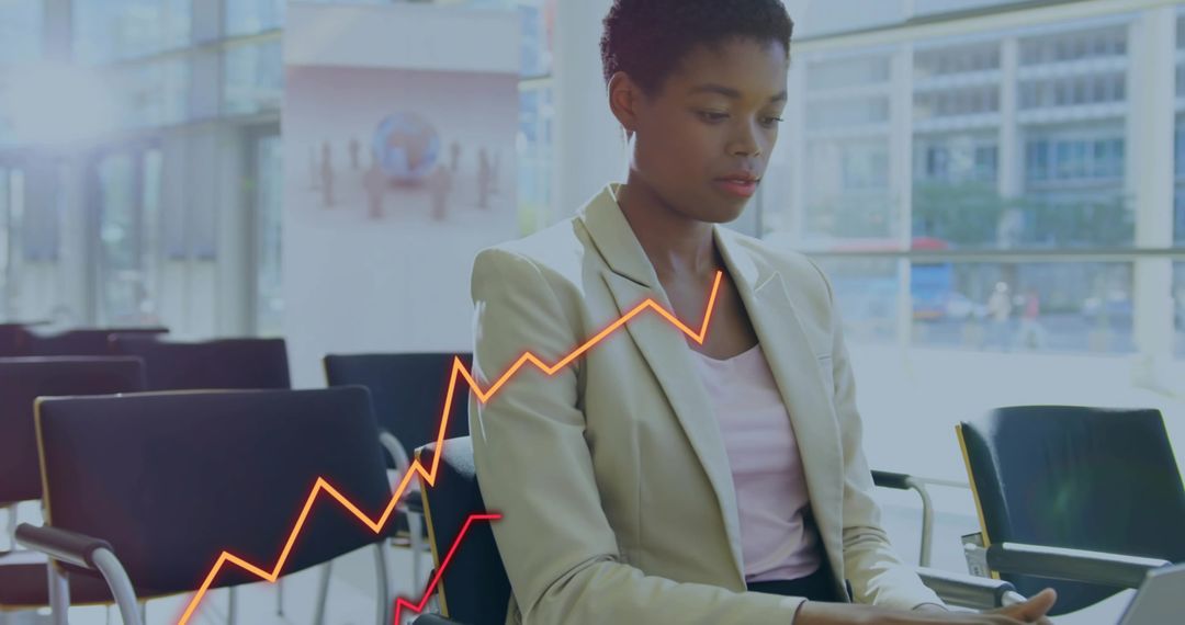 Focused Businesswoman Analyzing Data in Modern Office Lounge