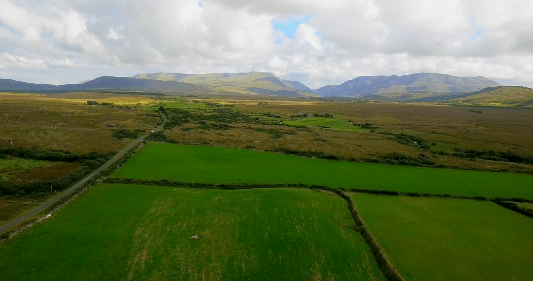Breathtaking Transparent Landscape View with Verdant Fields and Rolling Hills