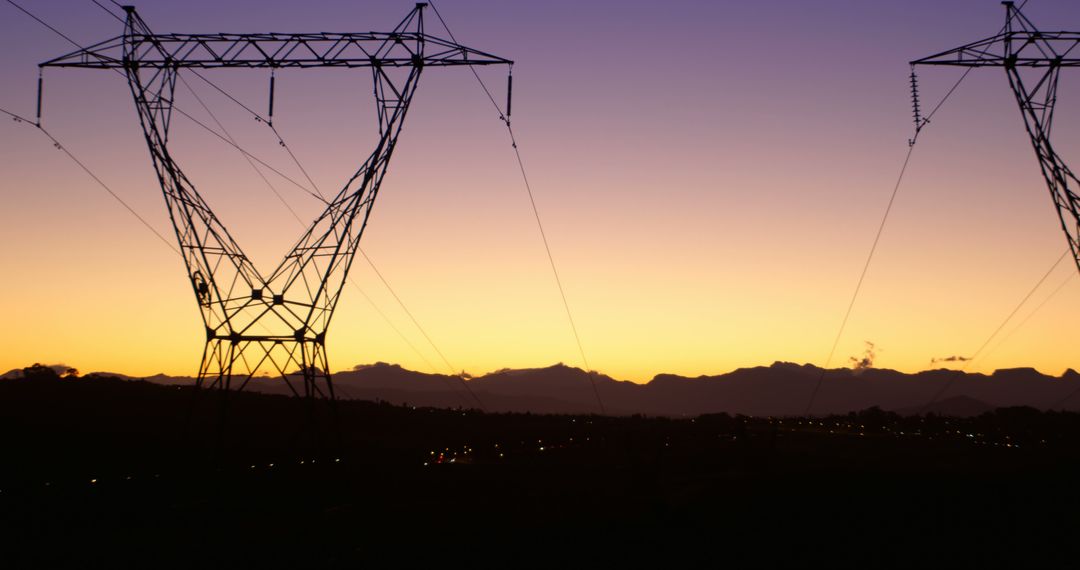 Silhouette of Power Lines at Sunset with Mountain Background - Free Images, Stock Photos and Pictures on Pikwizard.com