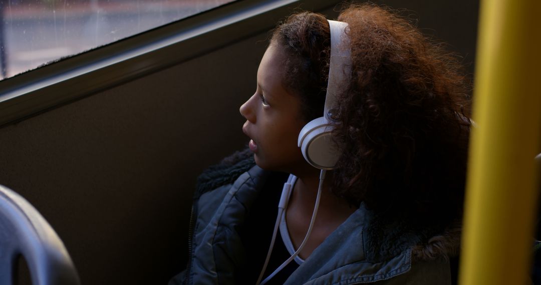 Teenager Listening to Music with Headphones on Window Seat - Free Images, Stock Photos and Pictures on Pikwizard.com