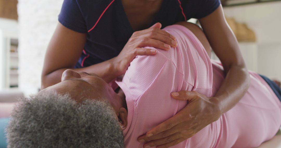 Physiotherapist Assisting Elderly Woman with Therapy Exercises Indoors - Free Images, Stock Photos and Pictures on Pikwizard.com