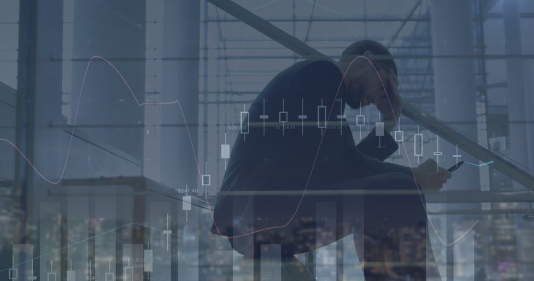 Stressed Businessman Analyzing Falling Financial Graphs