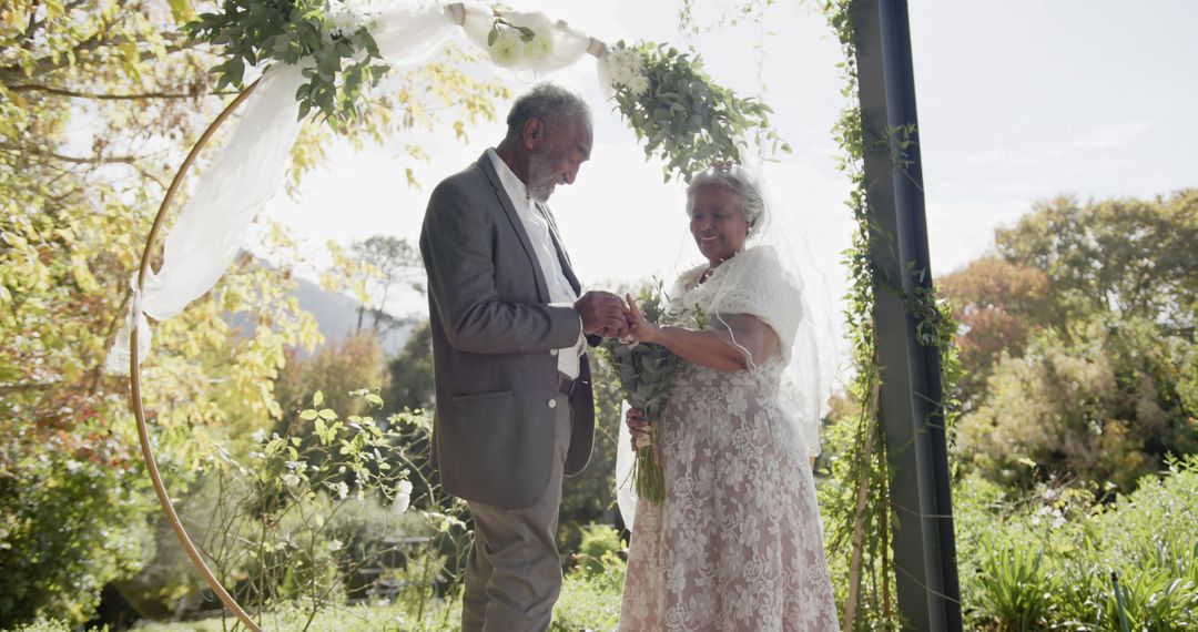 Elderly Couple Exchanging Vows at Outdoor Wedding in Garden - Free Images, Stock Photos and Pictures on Pikwizard.com