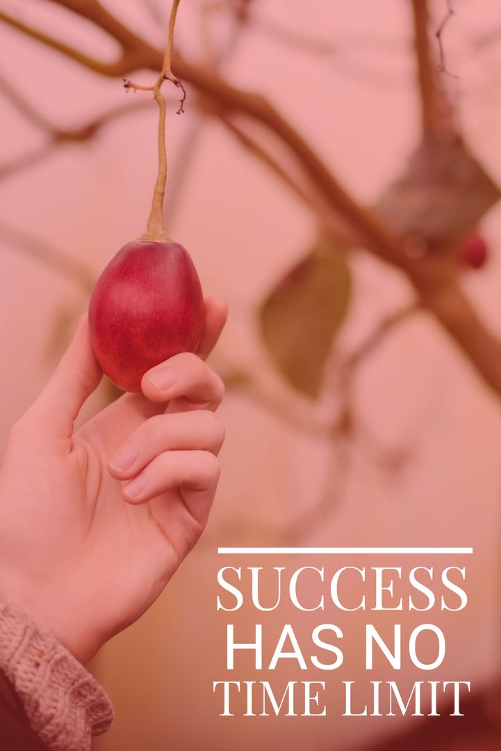 Hand Picking Ripe Fruit Symbolizes Success and Perseverance