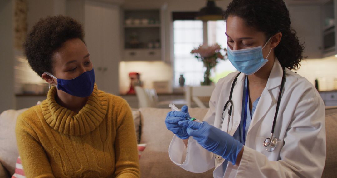 Female Doctor Preparing Vaccine in Home Visit with Patient - Free Images, Stock Photos and Pictures on Pikwizard.com