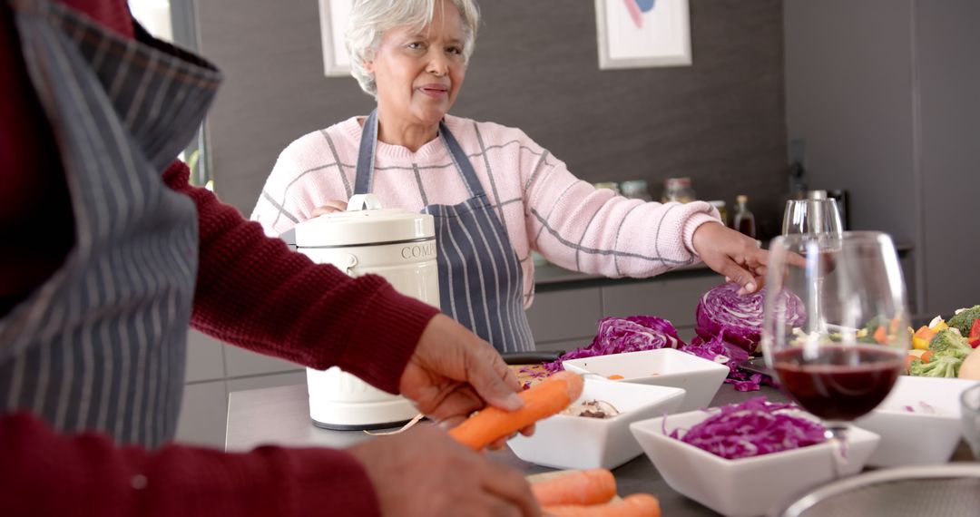 Elderly Couple Preparing Healthy Meal in Modern Kitchen - Free Images, Stock Photos and Pictures on Pikwizard.com