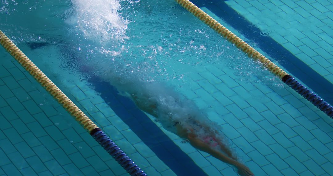 Underwater View of Swimmer Racing in Lane - Free Images, Stock Photos and Pictures on Pikwizard.com