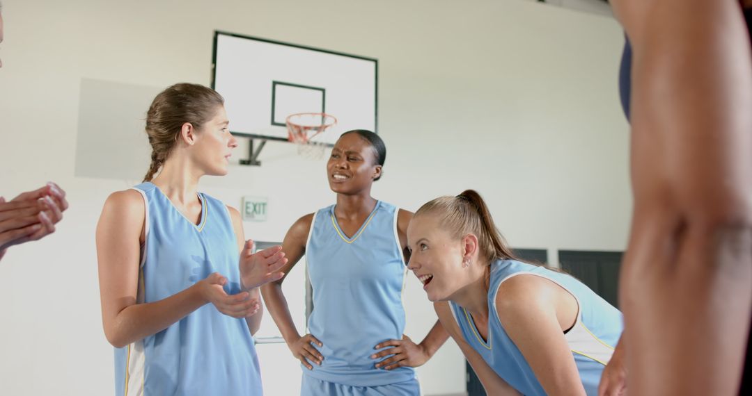 Diverse Female Basketball Team Planning Strategy on Court