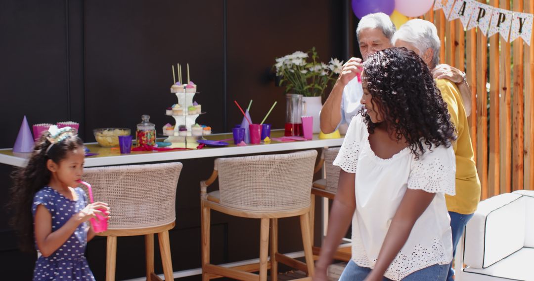 Joyful Family Birthday Celebration with Drinks in Colorful Setting