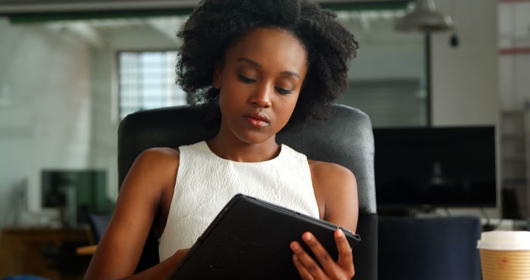 Professional Business Executive Analyzing Digital Tablet in Modern Office