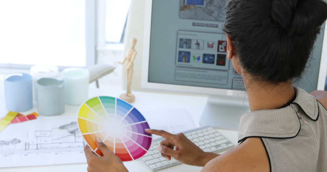 Designer Working Using Color Palette in Modern Office - Free Images, Stock Photos and Pictures on Pikwizard.com