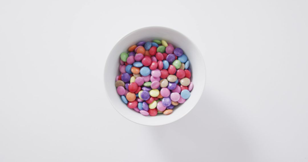 Colorful Candy in White Bowl on White Background - Free Images, Stock Photos and Pictures on Pikwizard.com