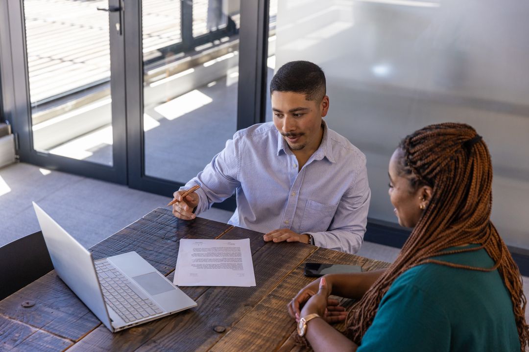 Colleagues Reviewing Project in Modern Office Setting