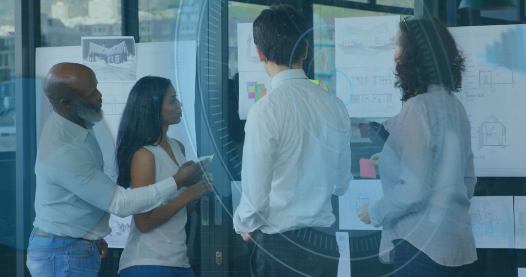 Diverse Team Collaborating with Technology Overlay