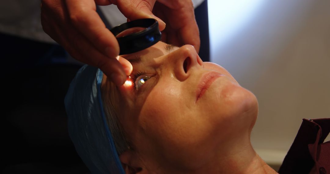 Ophthalmologist Examining Eyes of Female Patient with Flashlight - Free Images, Stock Photos and Pictures on Pikwizard.com