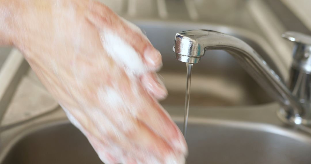 Close-up of Hands Washing with Soap Under Faucet in Kitchen - Free Images, Stock Photos and Pictures on Pikwizard.com