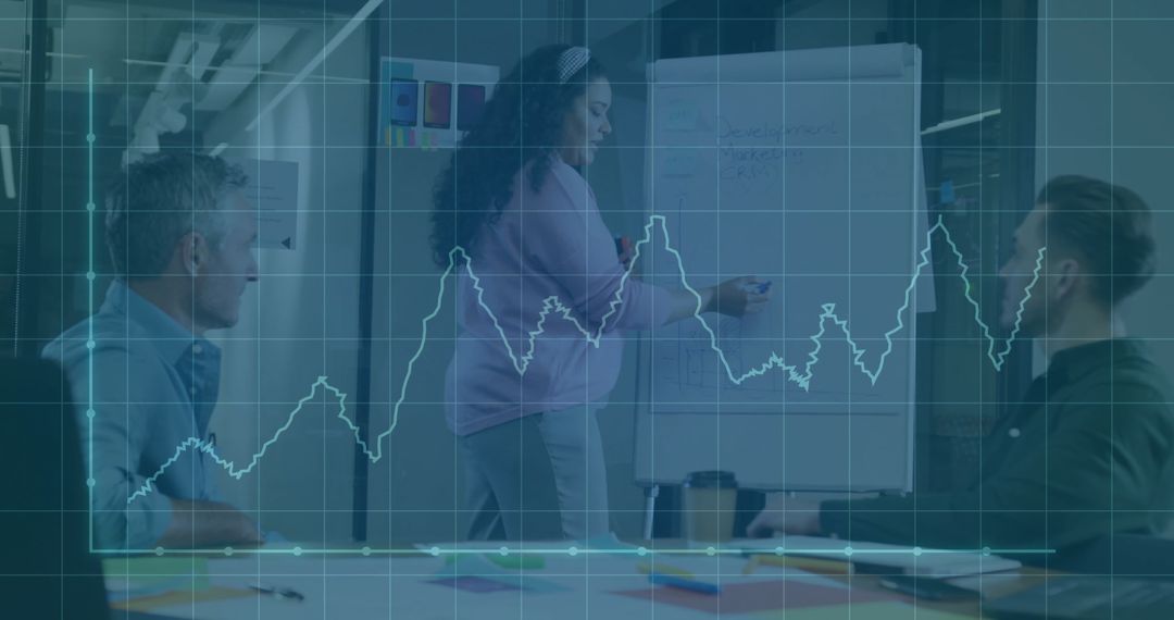 Woman Presenting in Office Meeting with Financial Graph Overlay