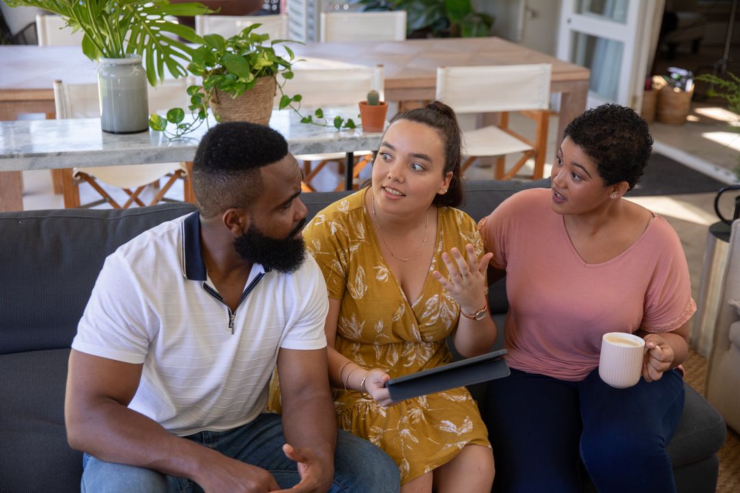 Diverse Friends Engaging in Conversation at Home Gathering