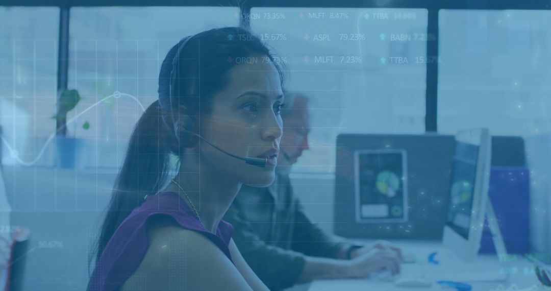 Diverse Coworkers Analyzing Data with Headsets in Modern Office