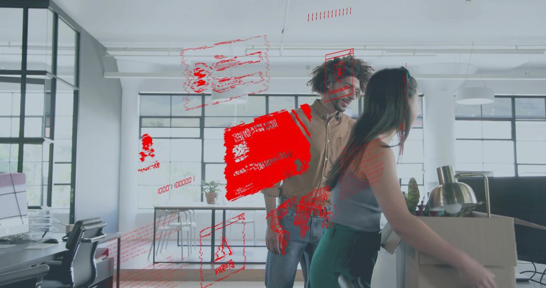 Young professionals unpacking in modern open-plan office with red cybersecurity alert overlay