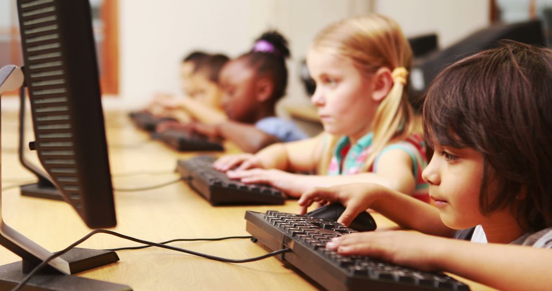 Children Engaged in Computer Lab Learning Technology Skills