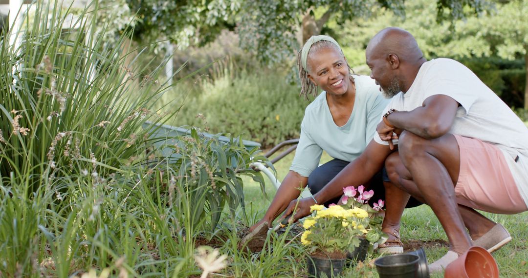 Smiling Senior Couple Gardening in Sunny Backyard - Free Images, Stock Photos and Pictures on Pikwizard.com