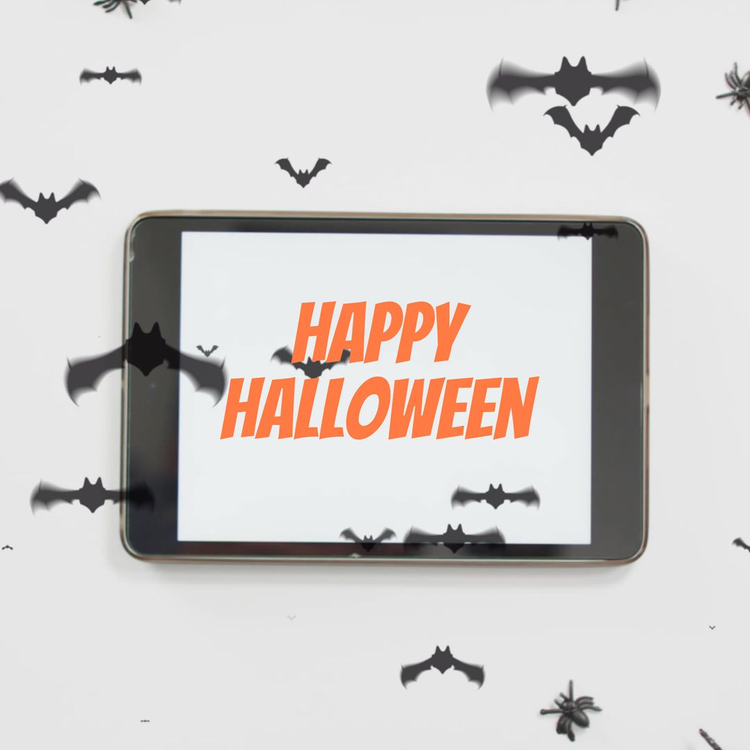 Halloween Greetings on Tablet Surrounded by Bats
