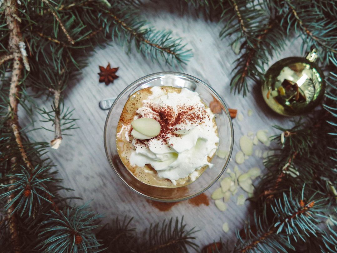 Festive Coffee Delight Surrounded by Pine Branches