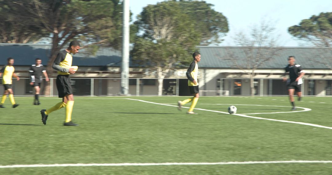 Team Practicing Soccer on Sunny Field Preparing for Upcoming Game