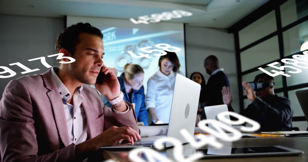 Team Focused on Digital Data Processing in Modern Office