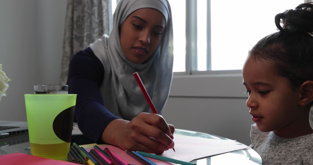Diverse Mother and Daughter Enjoy Creative Art Activity at Home