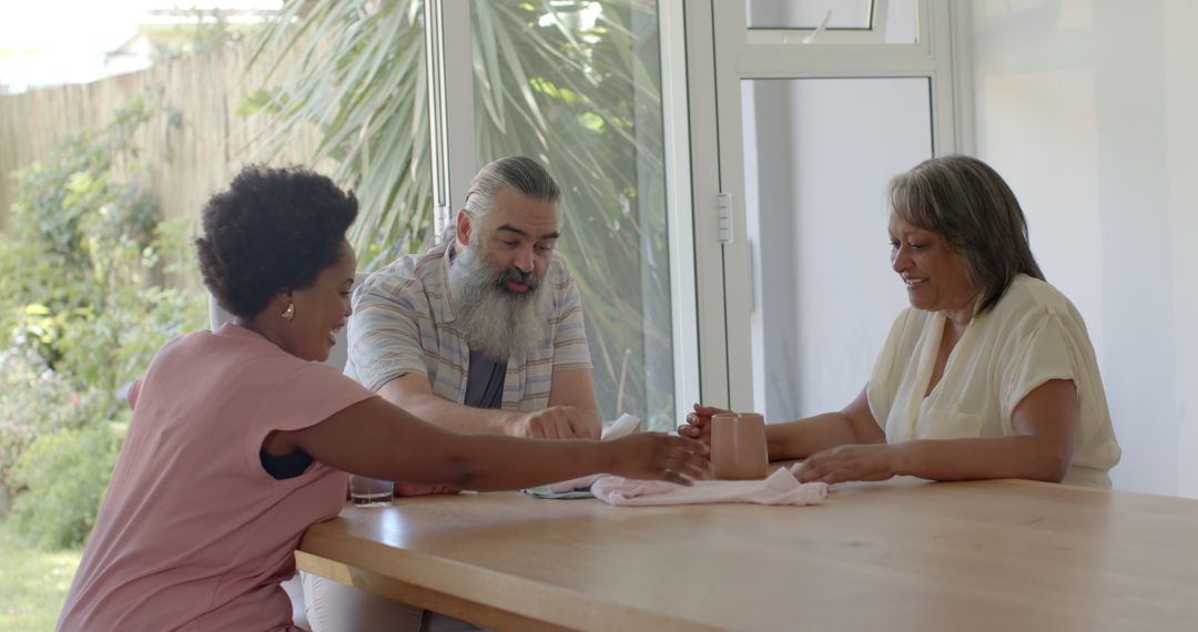 Diverse Friends Enjoying Conversation at Dining Table