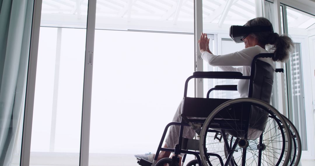 Disabled Senior Woman Using Virtual Reality Headset at Home - Free Images, Stock Photos and Pictures on Pikwizard.com