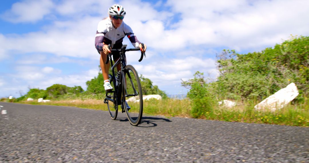 Professional Cyclist Riding Road Bike on Sunny Day - Free Images, Stock Photos and Pictures on Pikwizard.com