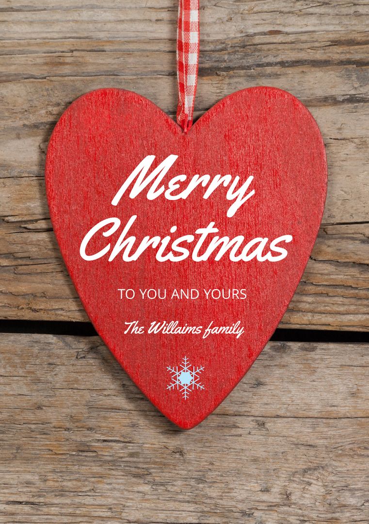 Red Heart Ornament with Merry Christmas Greeting on Wooden Background