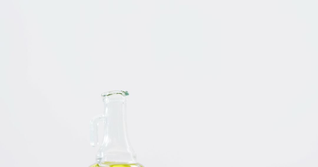 Glass bottle of olive oil on white background - Free Images, Stock Photos and Pictures on Pikwizard.com