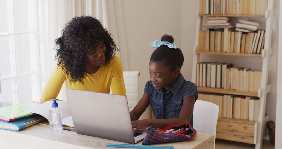 African American Mother and Daughter Smiling While Using Laptop at Home - Free Images, Stock Photos and Pictures on Pikwizard.com